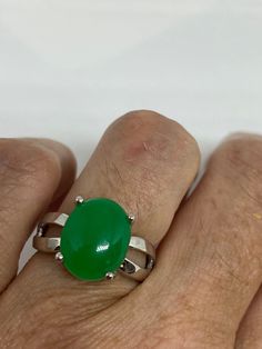 Vintage green nephrite jade Ornate German Silver ring, does not tarnish, NOT sterling Sizes 7, 8 or 9 All rings are shipped in a nice gift box. Check out our over a THOUSAND great reviews Engraving is $4 per letter and is not always perfect depending on the piece. It can take a few days if the jeweler is busy. This is payable to Paypal Judithsltd@gmail.com Classic Green Opal Cabochon Ring, Classic Green Jade Jewelry, Green Oval Opal Ring With Polished Finish, Jade Ring For May Birthstone Gift, Jade Rings For May Birthstone, Formal Green Hallmarked Opal Ring, Green Polished Finish Rings As Gift, Green Oval Cabochon Ring For Gift, Green Jade Ring Suitable For Gift