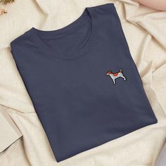 Express your individuality with our embroidered unisex t-shirt. Tailored to perfection, this tee offers a flawless stretchy fit and unmatched comfort. Enjoy premium cotton that wrap you in softness. We've put a lot of thought into creating designs that are all about having fun and letting your personality shine. So go ahead and express yourself! ✨ Pre-shrunk fabric ✨ Regular Fit ✨ Side-seamed construction ✨ Tear-away label ✨ Shoulder-to-shoulder taping Add personalized text or design to your t-shirt with the custom embroidery add-on: https://www.etsy.com/TofuTigerStudio/listing/1483466826 Size Length x Chest in cm XS: 68.6 x 42 S: 71 x 45.7 M: 73.7 x 50.8 L: 76.2 x 56 XL: 78.7 x 61 2XL: 81.3 x 66 3XL: 83.8 x 71 Pro tip! Measure one of your products at home and compare with the measurements Style Kawaii, Dad Caps, Embroidered Tshirt, Custom Embroidery, Embroidered Design, Playful Design, Having Fun, Unisex T Shirt, Organic Cotton