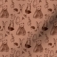 an animal print on a pink background with brown and white rabbits, bears, and other animals