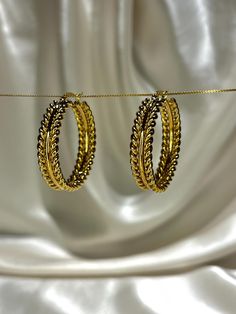 Stunning olive leaf hoops!  Slightly on the larger side-these versatile earrings can be donned casually or to complement formal outfits as well. Must have for your collection! MATERIAL 18K PVD real gold coating on 316L stainless steel. PVD allows the layer of gold to be resistant to water damage, sweat and scratches for an extended period of time. WHAT MAKES IT AWESOME: *Waterproof *Hypoallergenic- won't irritate sensitive skin *Anti-tarnish/Water-resistant  MEASUREMENTS (approx.) Diameter=3.5 cm JEWELRY CARE: Gold plated PVD jewellery is designed to be durable, yet it's important to handle it with care to prevent unnecessary wear and tear. * Remove your jewellery before swimming, in chlorine and salt water. Although if you were to take a cheeky dip every once in a while, you will be okay! Jewelry Hoop Earrings, 18k Gold Earrings, Formal Outfits, Earrings Bohemian, Olive Leaf, Waterproof Jewelry, 18k Gold Jewelry, Water Damage, Jewelry Earrings Hoops