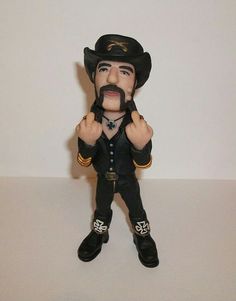 a figurine of a man with a mustache and moustache on his face