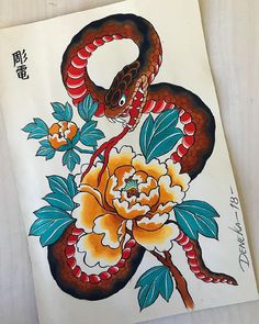 a drawing of a snake with flowers on it's back and an orange flower in its mouth