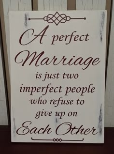 a sign that says a perfect marriage is just two imperfect people who refuse to give up on each other