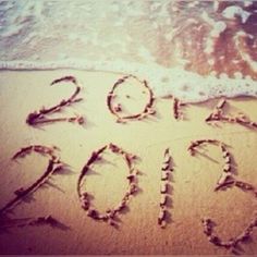 the year 2013 is written in the sand at the beach