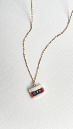 a necklace with a small camera attached to it