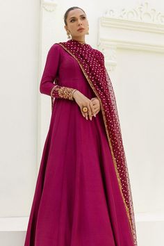 Maroon silk long Designer Anarkali Gown. This ensemble effortlessly combines traditional charm with contemporary flair, making it a perfect choice for women and girls who appreciate timeless elegance. The ensemble is paired with a stylish sequin embellished long dupatta that not only enhances the overall look but also adds a layer of sophistication. The dupatta features intricate detailing, showcasing expert craftsmanship and attention to detail. Whether you're attending a wedding, a festive cel Luxury Anarkali Salwar Kameez For Celebration, Luxury Anarkali Unstitched Suit With Dabka, Luxury Anarkali Salwar Kameez For Festivals, Luxury Jamawar Anarkali Set For Traditional Ceremonies, Luxury Dabka Anarkali Set For Eid, Luxury Anarkali Salwar Kameez With Mirror Work, Luxury Anarkali Katan Silk Salwar Kameez, Luxury Anarkali Unstitched Jamawar Suit, Luxury Jamawar Anarkali Set For Eid