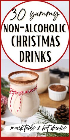 a glass filled with hot chocolate and cinnamon on top of a wooden table next to pine cones