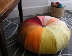 three different pictures of the same floor pillow and chair, one is multicolored