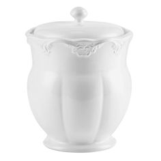 a white vase with an ornate design on the top and bottom, sitting in front of a white background