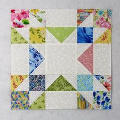 a patchwork quilt with many different colored squares