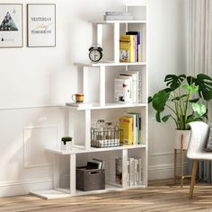 a white book shelf with books and other items on it next to a chair in a living room