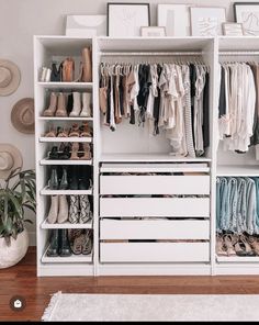 a white closet filled with lots of clothes and shoes