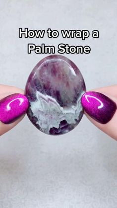 a person holding a marble ball in their hand with the words how to wrap a palm stone