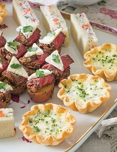 a white plate topped with pastries and meat