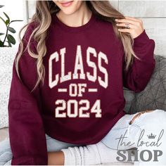 Class of 2024 Sweatshirt Collegiate 2024 Graduation Sweatshirt 2024 Varsity Graduate Sweater Class of 24 Custom Graduation Shirt You can choose a different year in the personalization box below, for example '2023' otherwise the 2024 version will be sent. Please allow 3-5 days for processing plus 3-5 days for shipping Ideal for any situation, a unisex heavy blend crewneck sweatshirt is pure comfort. This sweatshirt is made from polyester and cotton. This combination helps designs come out looking Varsity Long Sleeve Sweatshirt For College Events, Varsity Crew Neck Tops For College Events, Collegiate Long Sleeve Tops For College Events, Fall School Spirit Tops For College Events, Fall School Spirit Tops For Campus Wear, Long Sleeve Letter Print Tops For College Events, Letter Print Long Sleeve Tops For College, Long Sleeve Graphic Print Tops For College Events, Graphic Print Long Sleeve Tops For College Events