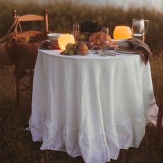 the table is set with plates and glasses