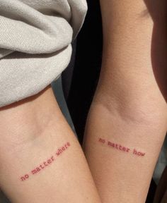 two people with matching tattoos that say no matter what they are written on their arms