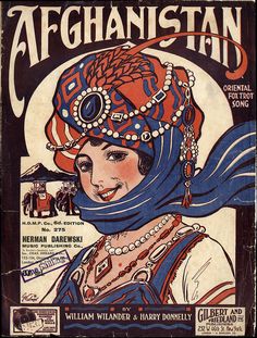 an old poster with a woman's face wearing a blue scarf and headdress