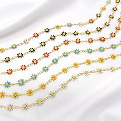 This listing is for a resizable gold plated enamel daisy chain choker made from brass, stainless steel, and gold plating. Choker is 14” with a 3.5” extension, maximum length is 17.5”. Great for layering! Available in white, yellow, blue, red, black, and multicolor. Cheap Adjustable Yellow Choker, Trendy Resizable Jewelry For Spring, Summer Choker With Clavicle Chain As Gift, Summer Clavicle Chain Choker As Gift, Gold Resizable Choker As Gift, Resizable Gold Choker As Gift, Spring Metal Jewelry With Adjustable Chain, Dainty Spring Jewelry With Adjustable Chain, Spring Dainty Jewelry With Adjustable Chain