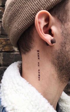 a man with a tattoo on his neck