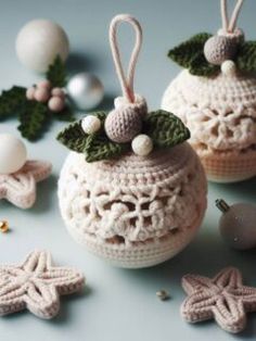 crocheted ornaments are displayed on a table