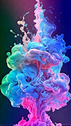 colorful liquid is pouring into the water and it looks like they are floating in the air