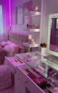 a room filled with lots of pink and white furniture