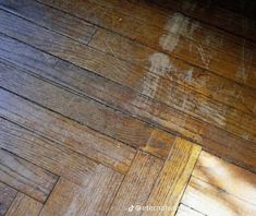 the wood floor is dirty and needs to be cleaned