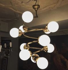 a chandelier hanging from the ceiling in a room