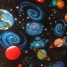 an image of the planets and stars in space printed on black cotton fabric with blue, red, green, orange, yellow and white colors