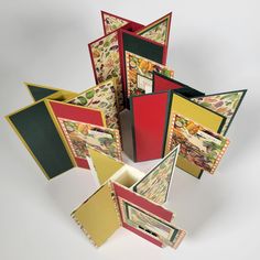 many cards are stacked together on top of each other in different colors and shapes,