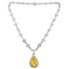 Platinum diamond necklace with GIA certified center 35.31 fancy intense vivd yellow vs2 pear shape, GIA#2145952743 set in platinum handmade necklace, features 47.00ct of outside diamonds D/E/F VVS-VS quality. Plus center 1.50ct pear e vs1 GIA#24155411814 Most Expensive Jewelry, Expensive Necklaces, Yellow Diamond Necklace, Drop Necklaces, Diamond Pendant Sets, Yellow Diamonds, Yellow Jewelry, Diamond Necklace Set, Unique Diamond Rings