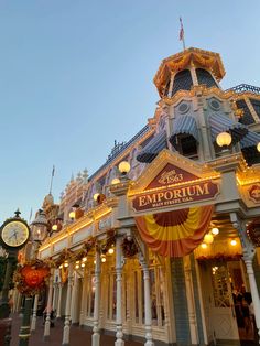 the exterior of an amusement park with lights and decorations on it's front entrance