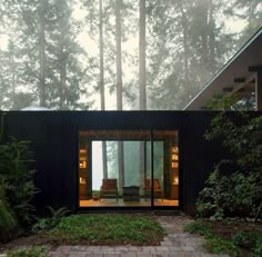 a small house in the middle of a forest