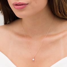 Complete any look in sparkling style with this effortless diamond pendant. Crafted in precious 10K rose gold, this tailored choice showcases a scintillating 1/2 ct. diamond solitaire. Polished to a bright shine, this pendant suspends along an 18.0-inch rope chain that secures with a spring-ring clasp. Diamond Drop Pendant, Simple Diamonds, Diamond Solitaire Necklace, Rose Gold Pendant, Rose Gold Chain, Solitaire Necklaces, Solitaire Pendant, Diamond Drops, Small Pendant