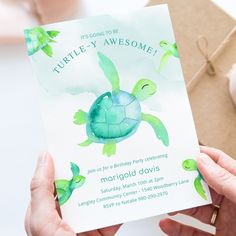 a person holding up a card with a turtle on it