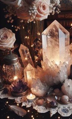 crystals, candles and flowers on a table