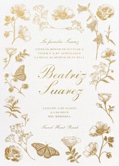 a wedding card with gold foil flowers and butterflies on the front, in white paper