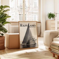 a magazine cover with a sailboat on it in a living room next to a potted plant