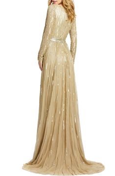 Look like you just stepped off the red carpet in this plunging V-neck gown illuminated with stripes of glittering sequins and light-catching beads. Style Name:Mac Duggal Long Sleeve Sequin & Bead Stripe Gown. Style Number: 5903330. Red Carpet Embellished Floor-length Gown, Floor-length Embellished Gown For Red Carpet, Luxury Sequined V-neck Gown, Luxury V-neck Gown With Sequins, Glamorous Embellished Gown For Red Carpet, Luxury V-neck Sequined Gown, Macys Women, Mesh Gown, Long Sleeve Sequin