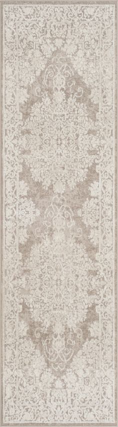 a beige and white rug with an intricate design