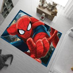 a spiderman rug is on the floor in a child's room