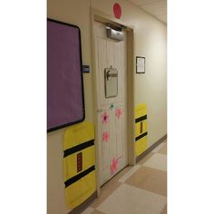 the hallway is decorated with yellow and pink decorations