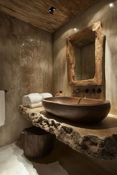 a bathroom with a large wooden bowl sink