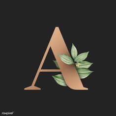 the letter a with leaves on it is made up of gold and green foil paper