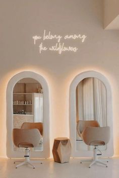 a couple of chairs sitting in front of a mirror neon sign Home Salon Set Up, Salon Set Up Ideas, Boho Salon Suite, Boho Salon Ideas, Modern Hair Salon Interior Design, Aesthetic Boutique, Leaning Floor Mirror, Arch Floor Mirror, Among The Wildflowers