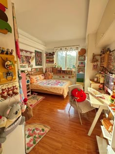 a room filled with lots of clutter and stuffed animals on the floor next to each other