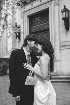 Maggie and Angus kissing after their wedding at Chelsea Old Town Hall London. Romantic Wedding Photography, Black And White Portraits