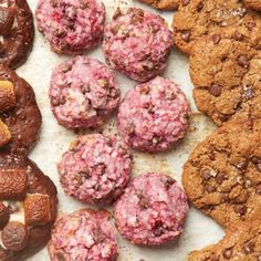 cookies and pastries are arranged on a table