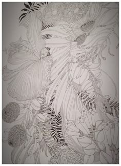 a drawing of flowers and leaves on a wall